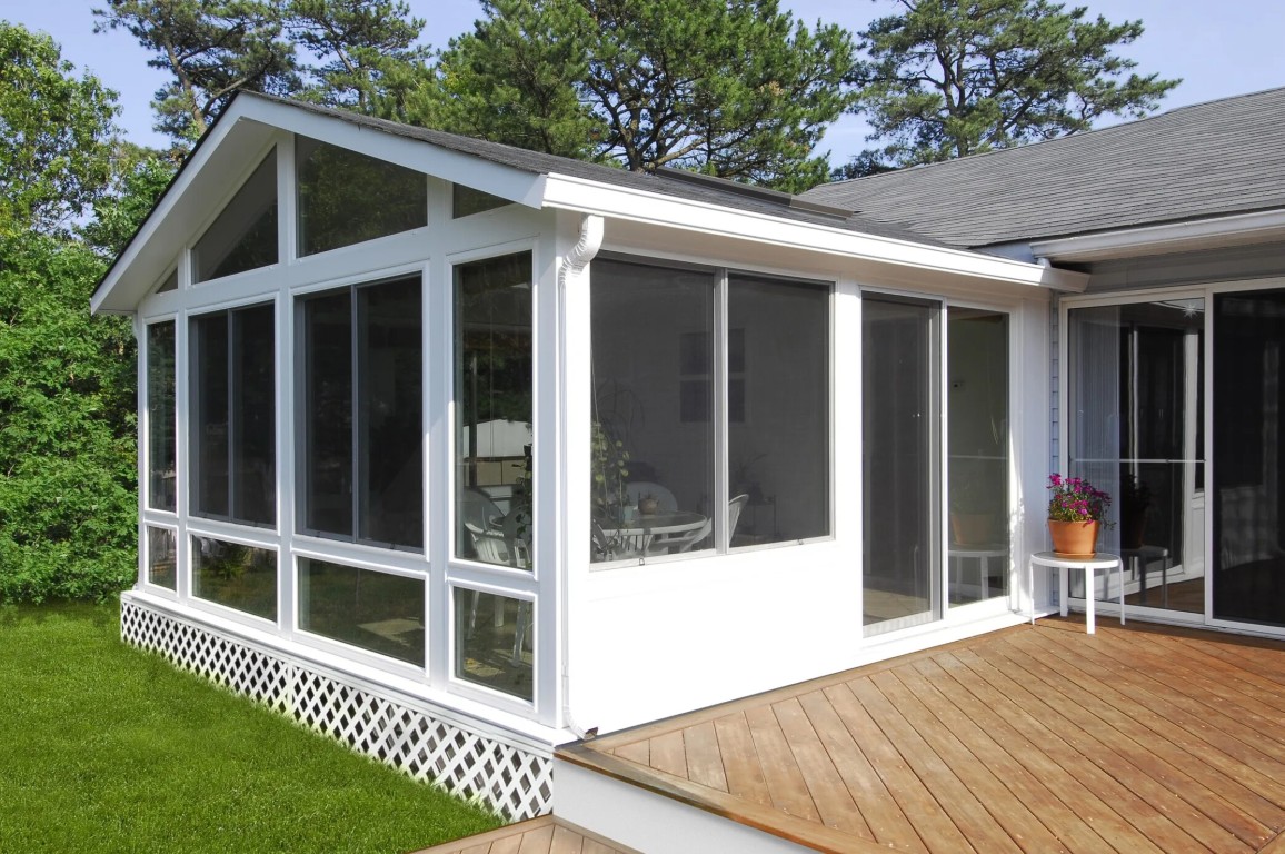 Three-season sunroom with screen panels for natural ventilation